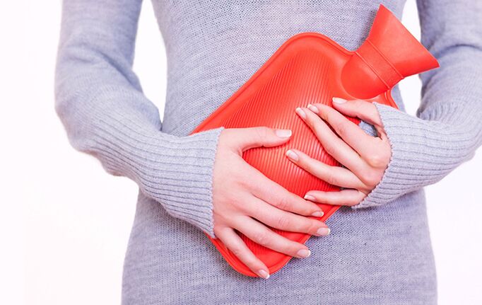 Applying a heating pad to the stomach will help alleviate the symptoms of cystitis in women.